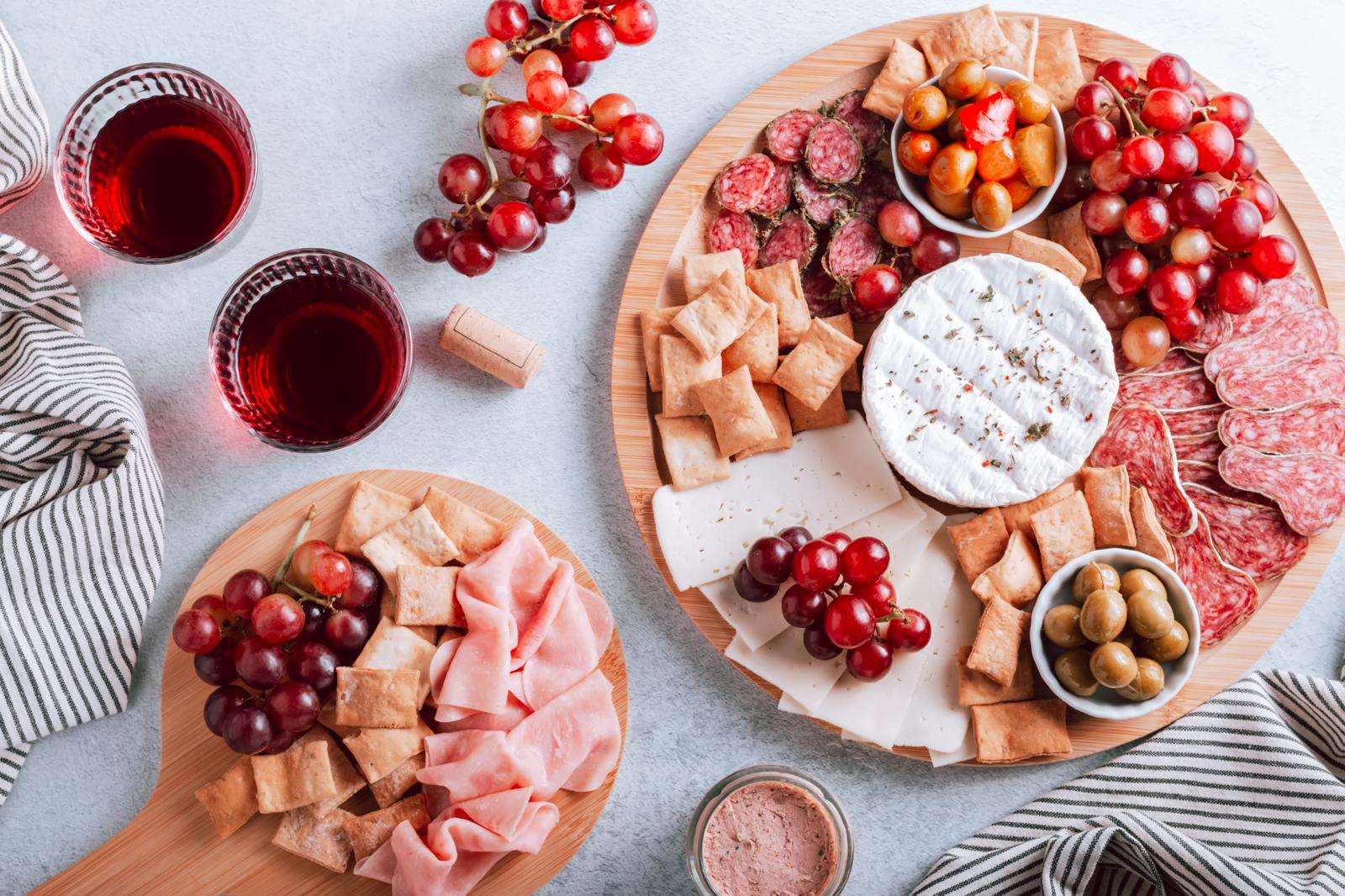 large charcuterie grazing table with variety of meats, cheeses, and accompaniments, overhead view, professional photography